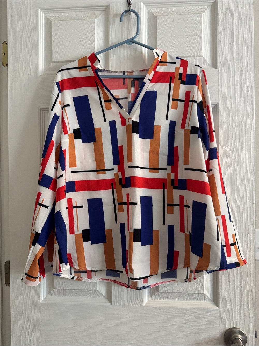 Geometric V-Neck Blouse in White with Blue, Red & Tan Blocks